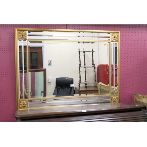 521 - Modern gilt framed and bevelled glass bordered wall mirror, 114cm x 85cm