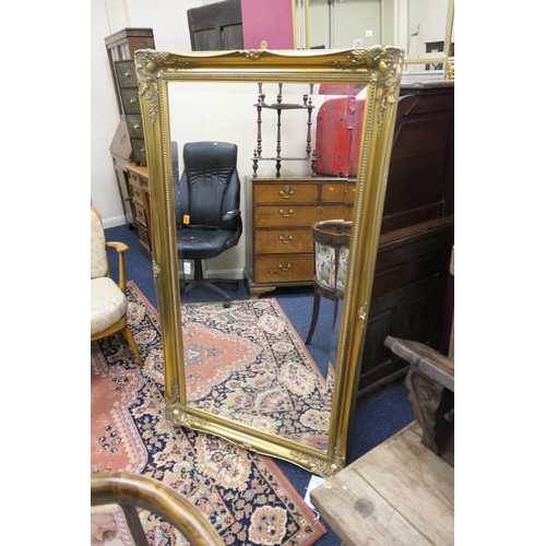 523 - Large swept gilt framed bevelled glass over mantel mirror, 137cm x 76cm