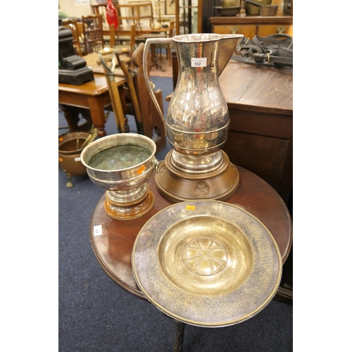 552 - Ecclesiastical planished silver plated holy water jug on a carved oak plinth base; also a planished ... 