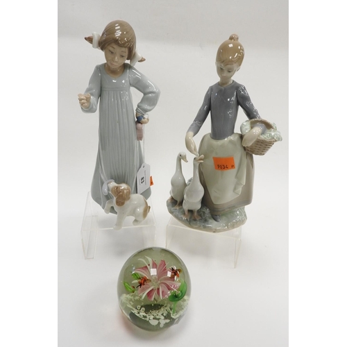 83 - Lladro figurine of a goose girl, Nao figurine of a child and puppy and a glass spherical paperweight... 