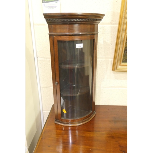 494 - Mahogany small bow front hanging corner display cabinet, height 67.5cm