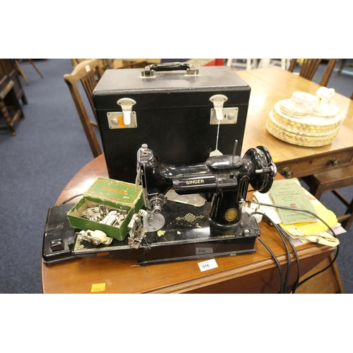 517 - Singer Portable Electric Sewing Machine, No. 221K, with carrying case, instructions and accessories ... 