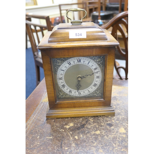 534 - Walnut cased quartz mantel clock