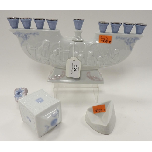 144 - Jewish interest: Embossed Lladro Menorah; also a Lladro Jewish Dreidel, no. 6679, both boxed (2)