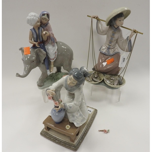 160 - Three Lladro figurines including an Indian marriage couple on top of an elephant, kneeling Japanese ... 