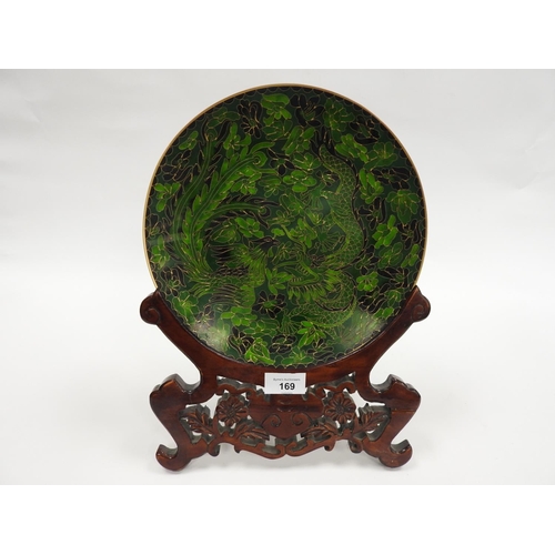 169 - Chinese Republic green cloisonne plate decorated with dragon and phoenix on a scrolled hardwood stan... 