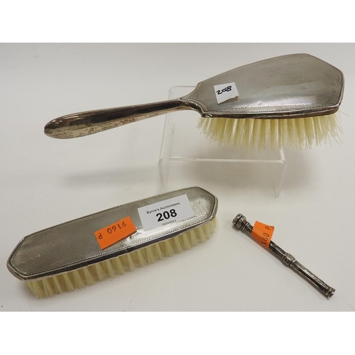 208 - Two piece silver hairbrush set, Birmingham 1961; also a silver propelling pencil (3)