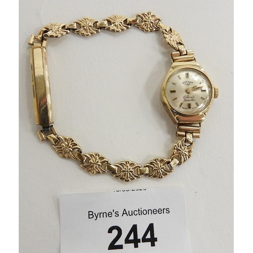 244 - 9ct gold lady's wristwatch fitted with a gold plated bracelet