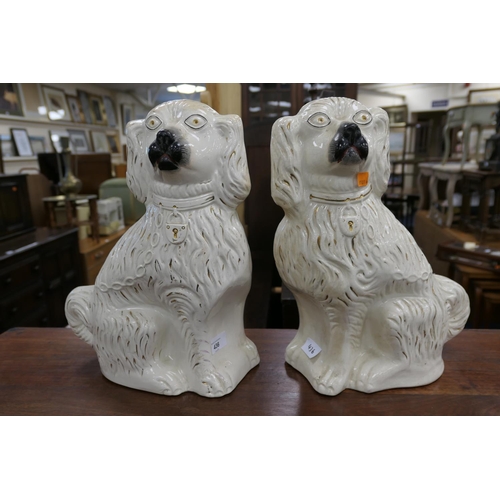 436 - Pair of Victorian Staffordshire spaniels, height 38cm