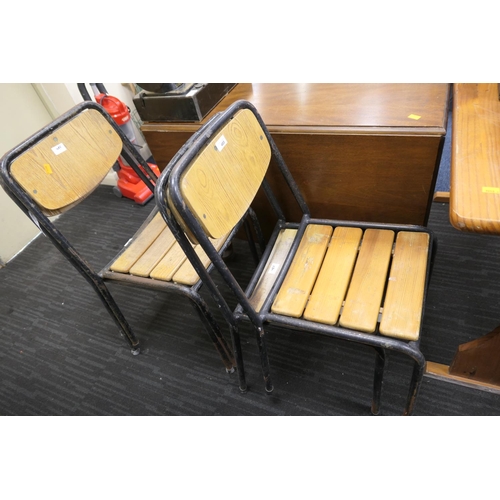 485 - Four tubular steel framed stacking chairs with wooden seats