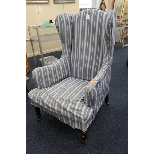 552 - Victorian mahogany and upholstered high back wing armchair in loose cover upholstery