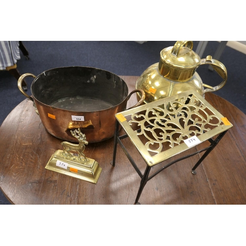 554 - Victorian copper twin handled casserole pan, also a large Guernsey brass milk jug, a Victorian brass... 