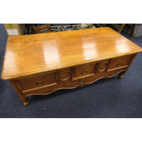 562 - French oak coffee table fitted with drawers, 122cm x 59cm