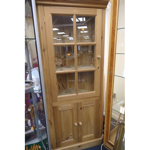 564 - Modern pine free standing glazed corner cupboard