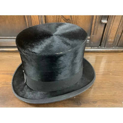 406 - Dunn & Co. top hat, with leather hat box, also a Dunn & Co. bowler hat (3)