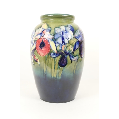 62 - Large Moorcroft frilled and slipper orchids vase, circa 1953, ovoid form, the flowers picked out in ... 