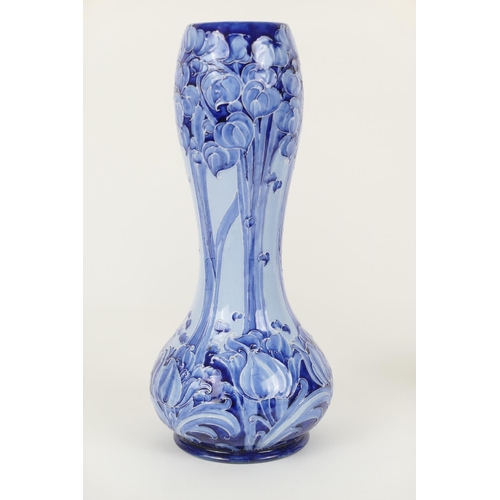 63 - William Moorcroft for Macintyre, Florian vase, circa 1900, slender waisted form decorated with crocu... 