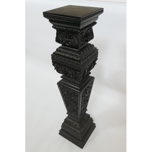 771 - Continental carved ebonised torchere, square plinth on an acanthus vine carved, tapered, square sect... 