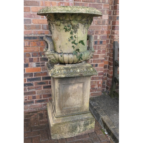 777 - Terracotta garden urn on plinth, 19th Century, campagna shaped bowl cast with fruiting vines and wit... 