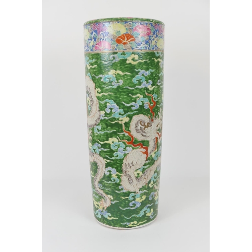 79 - Japanese porcelain stick stand, decorated with a three toed dragon against a green ground, height 62... 