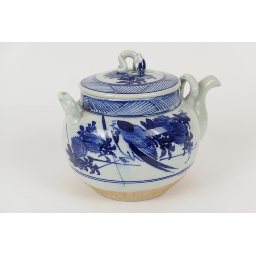 81 - Annamese blue and white teapot and cover, decorated with birds and calligraphic script over an ungla... 