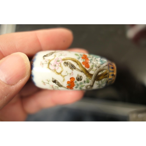 94 - Chinese porcelain snuff bottle, decorated with birds sitting amidst prunus blossom, in colours again... 