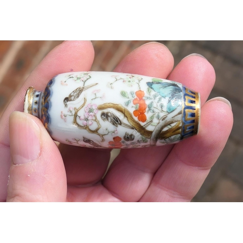 94 - Chinese porcelain snuff bottle, decorated with birds sitting amidst prunus blossom, in colours again... 