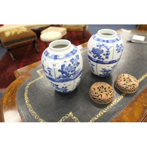 97 - Pair of Chinese blue and white jars, Kangxi mark and possibly of the period, ovoid form decorated wi... 