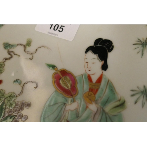 105 - Two Japanese porcelain plaques, decorated in Chinese famille rose style, 34cm diameter