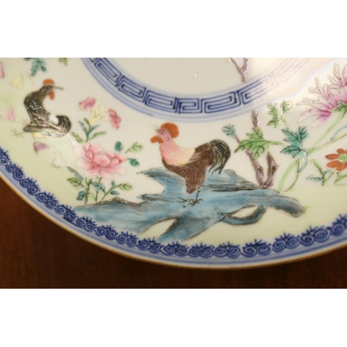 85 - Chinese famille rose plate, decorated with a cockerel and peony rock in colours, within an underglaz... 