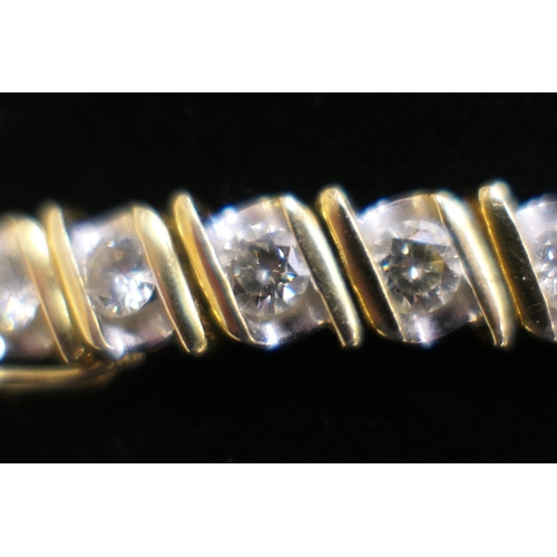 362 - Diamond line bracelet in 18ct two colour gold, set with 32 brilliant cut diamonds totalling approx. ... 