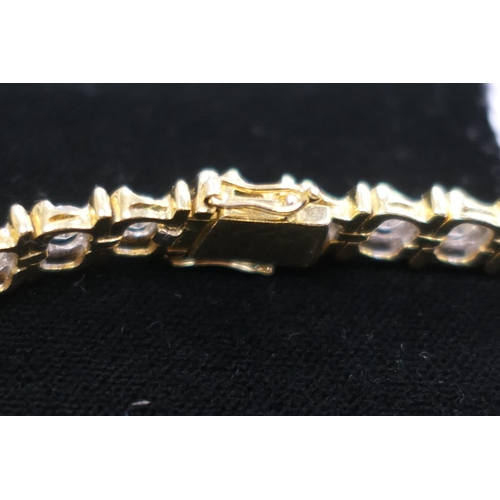 362 - Diamond line bracelet in 18ct two colour gold, set with 32 brilliant cut diamonds totalling approx. ... 