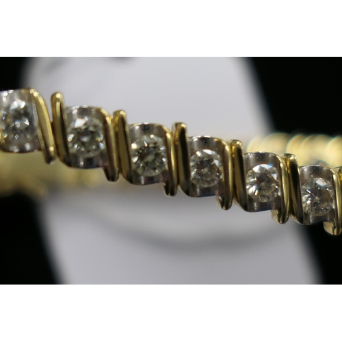 362 - Diamond line bracelet in 18ct two colour gold, set with 32 brilliant cut diamonds totalling approx. ... 