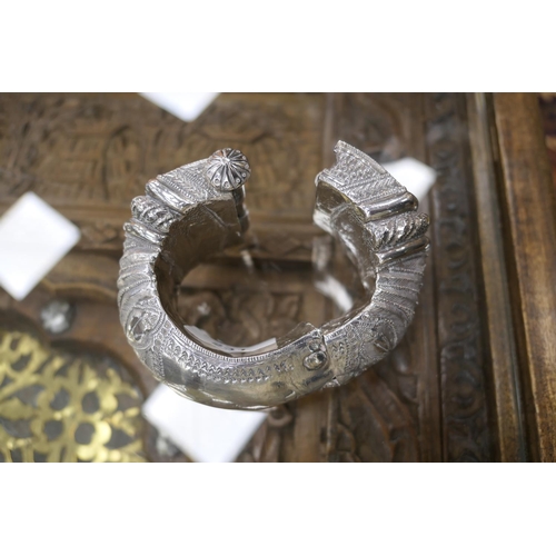 231 - Middle Eastern silver coin belt, supporting seven silver thalers, fronted with a 9cm engraved disc; ... 