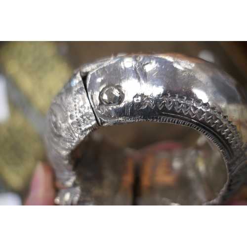 231 - Middle Eastern silver coin belt, supporting seven silver thalers, fronted with a 9cm engraved disc; ... 