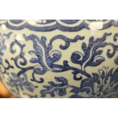 131 - Chinese large blue and white jar, in Ming style, 19th Century, decorated with stylised flowers and s... 