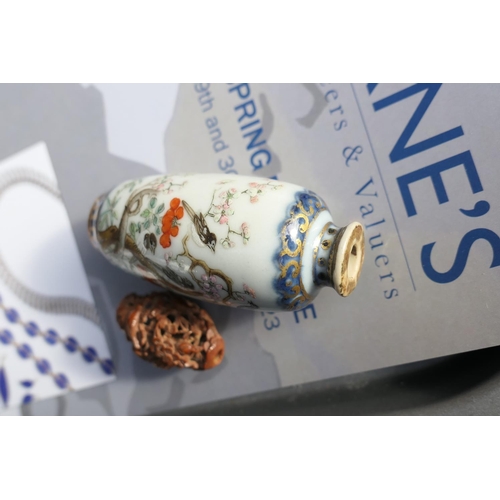 94 - Chinese porcelain snuff bottle, decorated with birds sitting amidst prunus blossom, in colours again... 