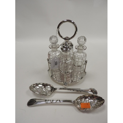 303 - Edwardian silver plated four bottle cruet stand and a pair of silver plated berry spoons