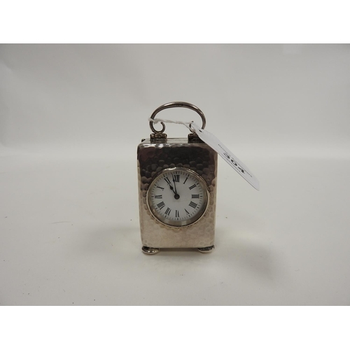 304 - Late Victorian silver miniature carriage clock, Birmingham 1900, the back plate centred with a carto... 