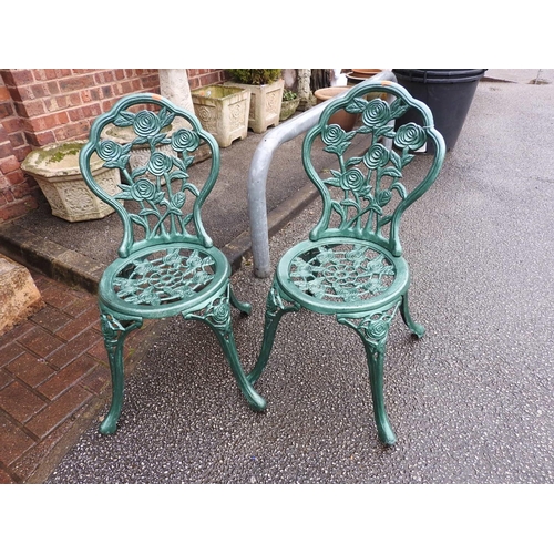 463 - Pair of green hammerite painted cast alloy garden chairs