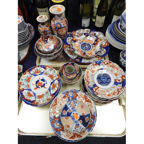 131 - Collection of Japanese Imari porcelain including numerous plates, some bowls and vases, all late Mei... 