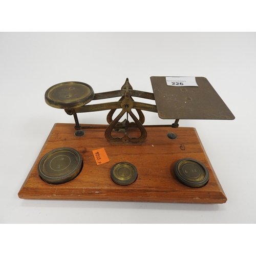 226 - Brass postal scales with weights