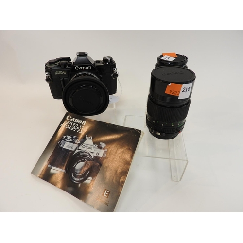 232 - Canon AE-1 35mm camera body together with a 135mm 1:2.8 lens and a 28mm 1:2.8 lens, with instruction... 