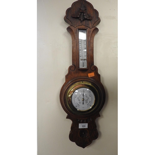 324 - Carved oak aneroid barometer