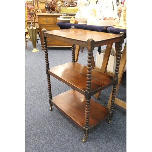 505 - Victorian mahogany three tier whatnot on castors, height 74cm