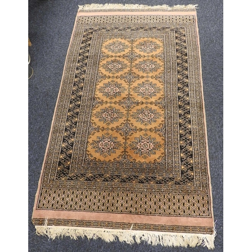 449 - Pakistani Bokhara fawn ground woollen rug, 156cm x 95cm