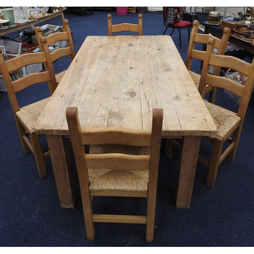 455 - Solid pine dining table fitted with a single drawer, length 183cm x 99cm and six beech rush seated d... 