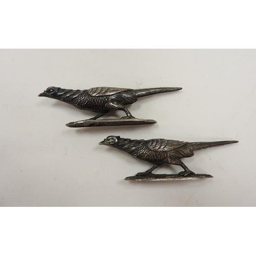 265 - Pair of unmarked white metal pheasant form cutlery rests, 10.5cm