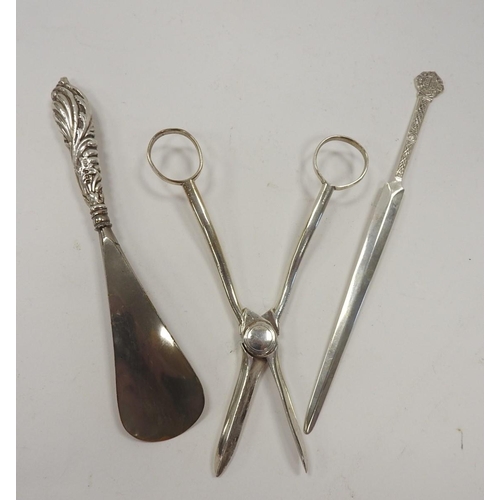 267 - Modern silver paper knife, Sheffield 1973, silver handled shoehorn and a pair of silver plated grape... 