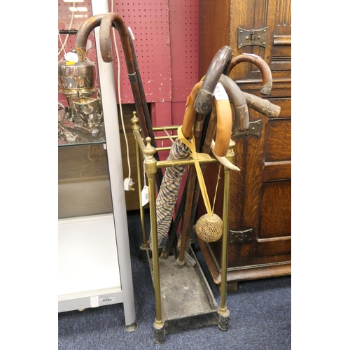 362 - Victorian brass and cast iron stick stand with assorted stick and brolly contents